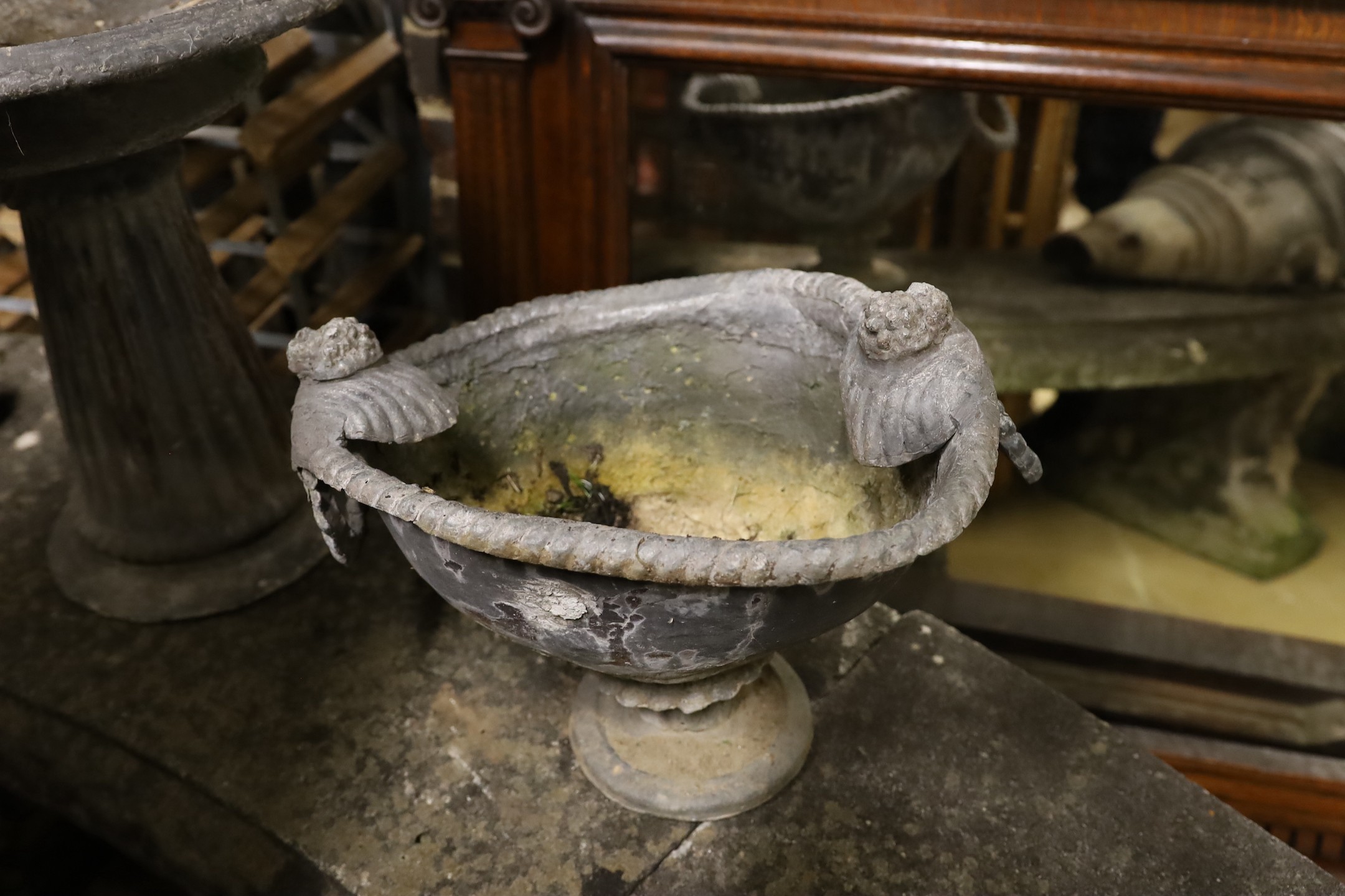 A lead garden bird bath with lion surmount, height 44cm together with a lead planter